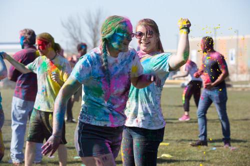 HOLI 2016 two students throwing color dust